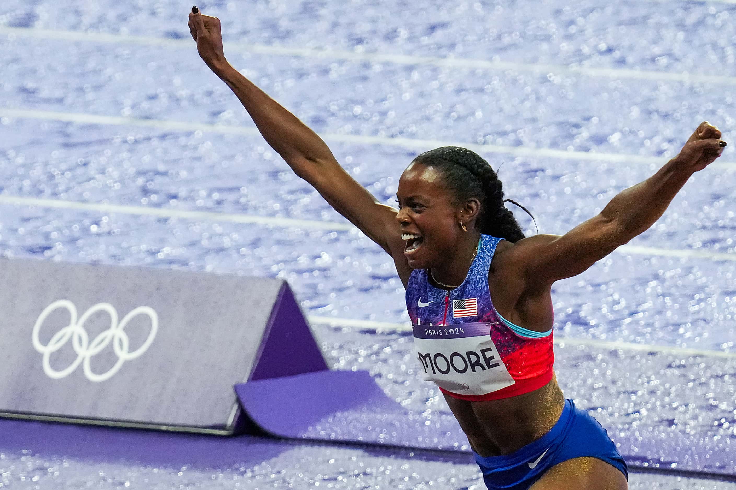 Jasmine Moore of the United States celebrates after winning the bronze medal in the women’s...
