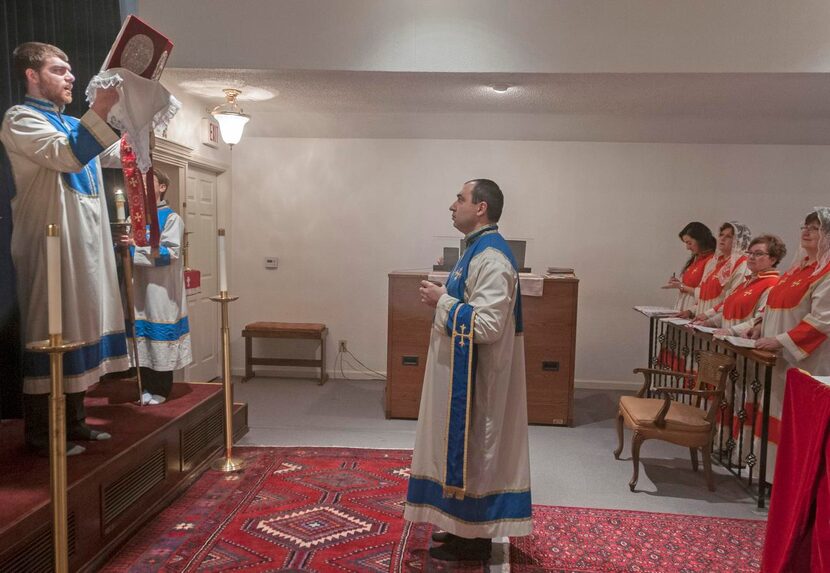 
Njteh Keleshian (left) a sub-deacon at St. Sarkis Armenian Orthodox Church, chants the...