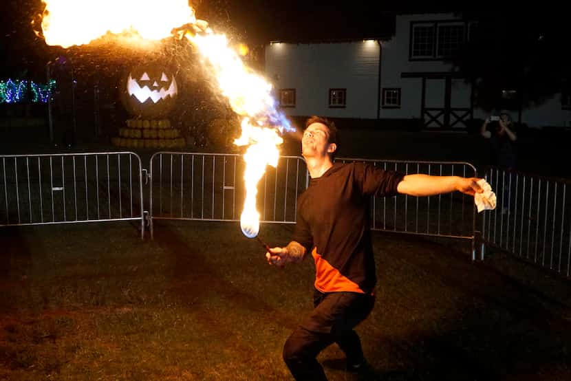 Fire Performer Collin Deleon performs at Pumpkin Nights in Arlington, Texas on Wednesday,...