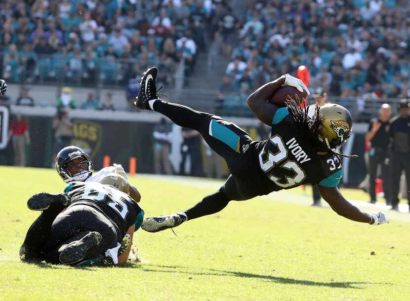 JACKSONVILLE, FL - DECEMBER 17:  Chris Ivory #33 of the Jacksonville Jaguars leaps with the...