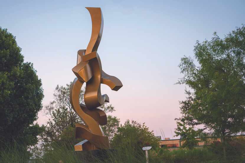 A golden spiral shaped art sculpture.