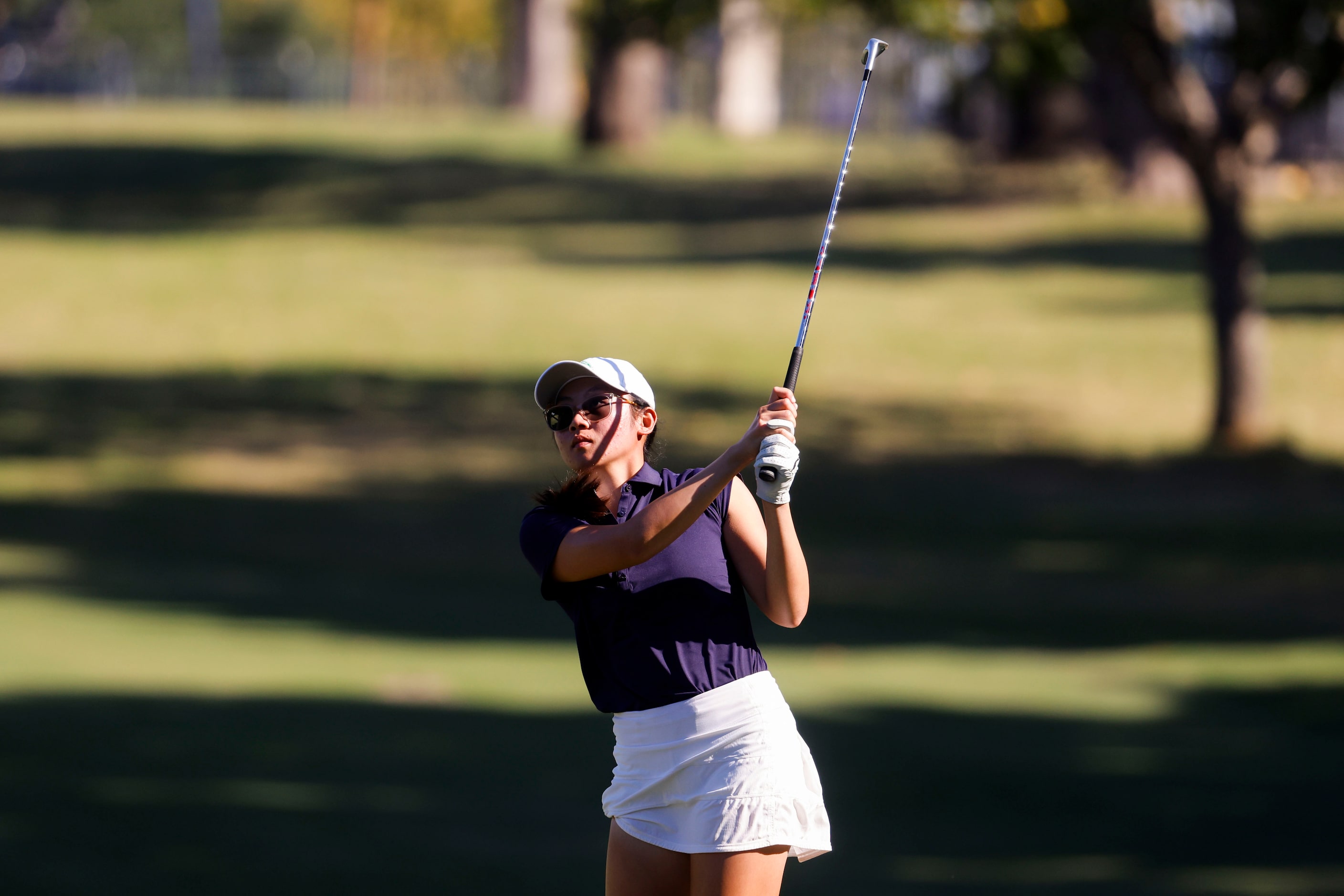 Malisone Chanthapanya of University of North Texas follows after hitting on the seventh...