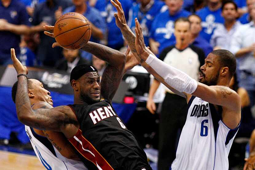 Miami Heat small forward LeBron James (6) has the ball knocked away by Dallas Mavericks...