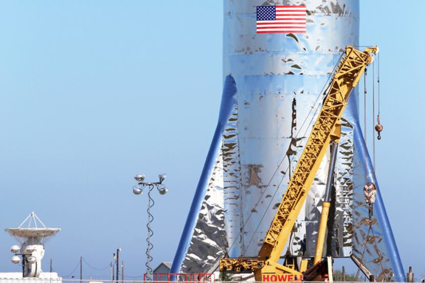 In this Jan. 12 photo, a SpaceX prototype Starship hopper rises at Boca Chica Beach along...