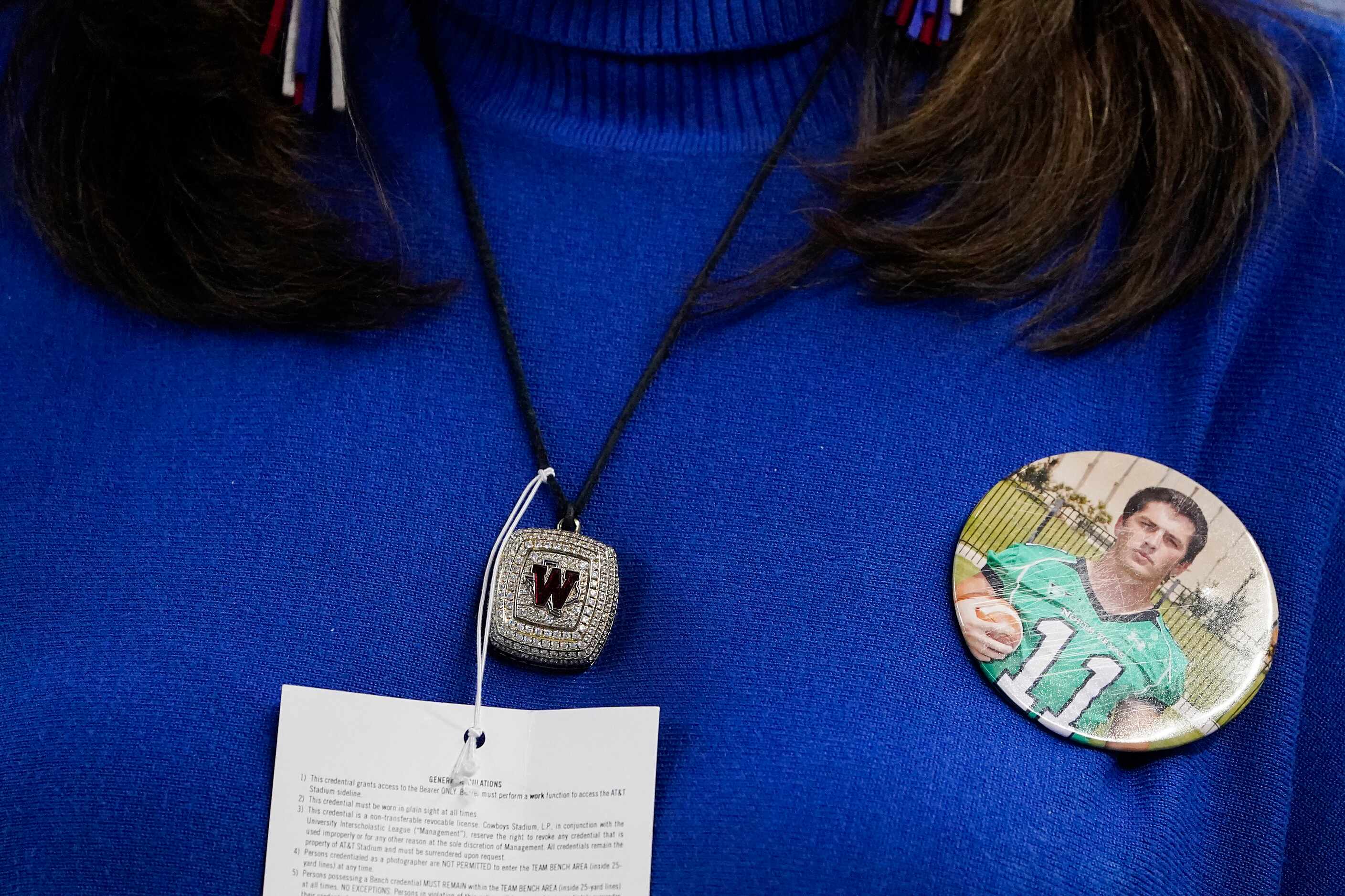 Elizabeth Dodge wears a Westlake pendant and the team colors colors, but also sports a...