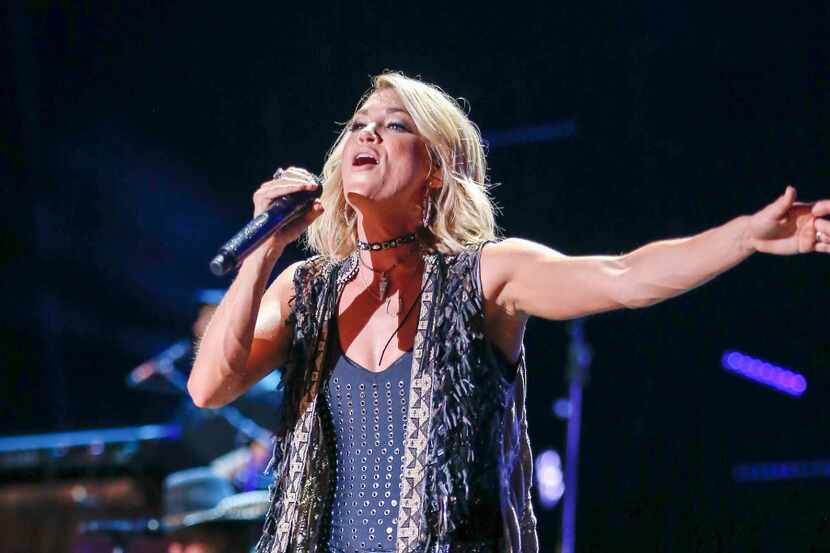 FILE - In a Friday, June 10, 2016 file photo, Carrie Underwood performs at the CMA Music...