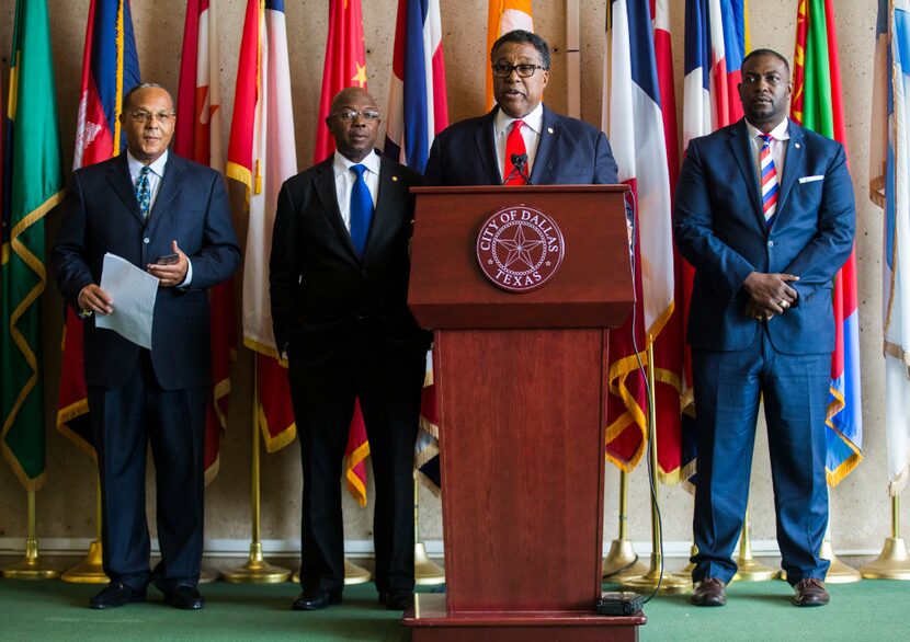 Dallas Mayor Pro Tem Dwaine Caraway (behind podium) and council member Tennell Atkins...