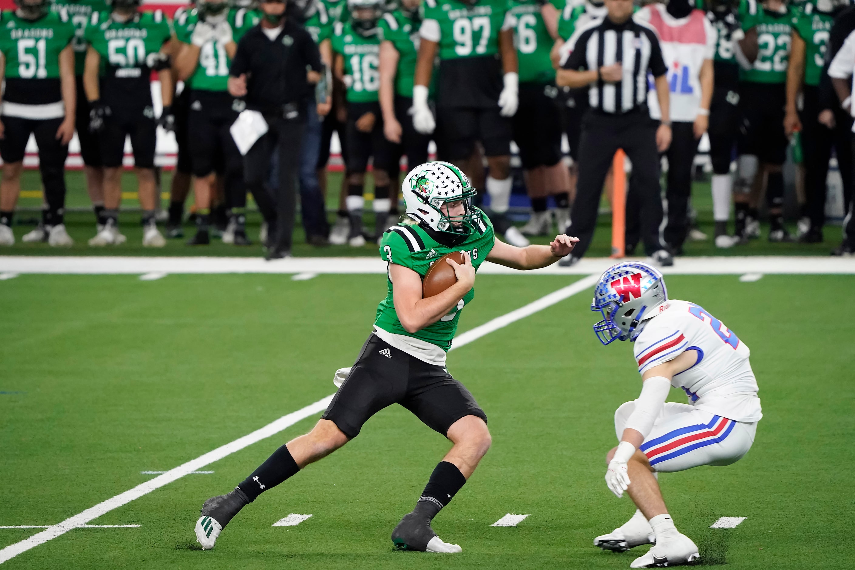 Southlake Carroll quarterback Quinn Ewers (3) tries to get past Austin Westlake defensive...