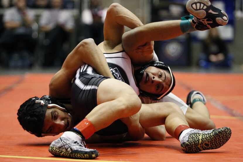 Gabriel Costa (left) of Prosper High School competes against Xavier Torres of Canyon Randall...