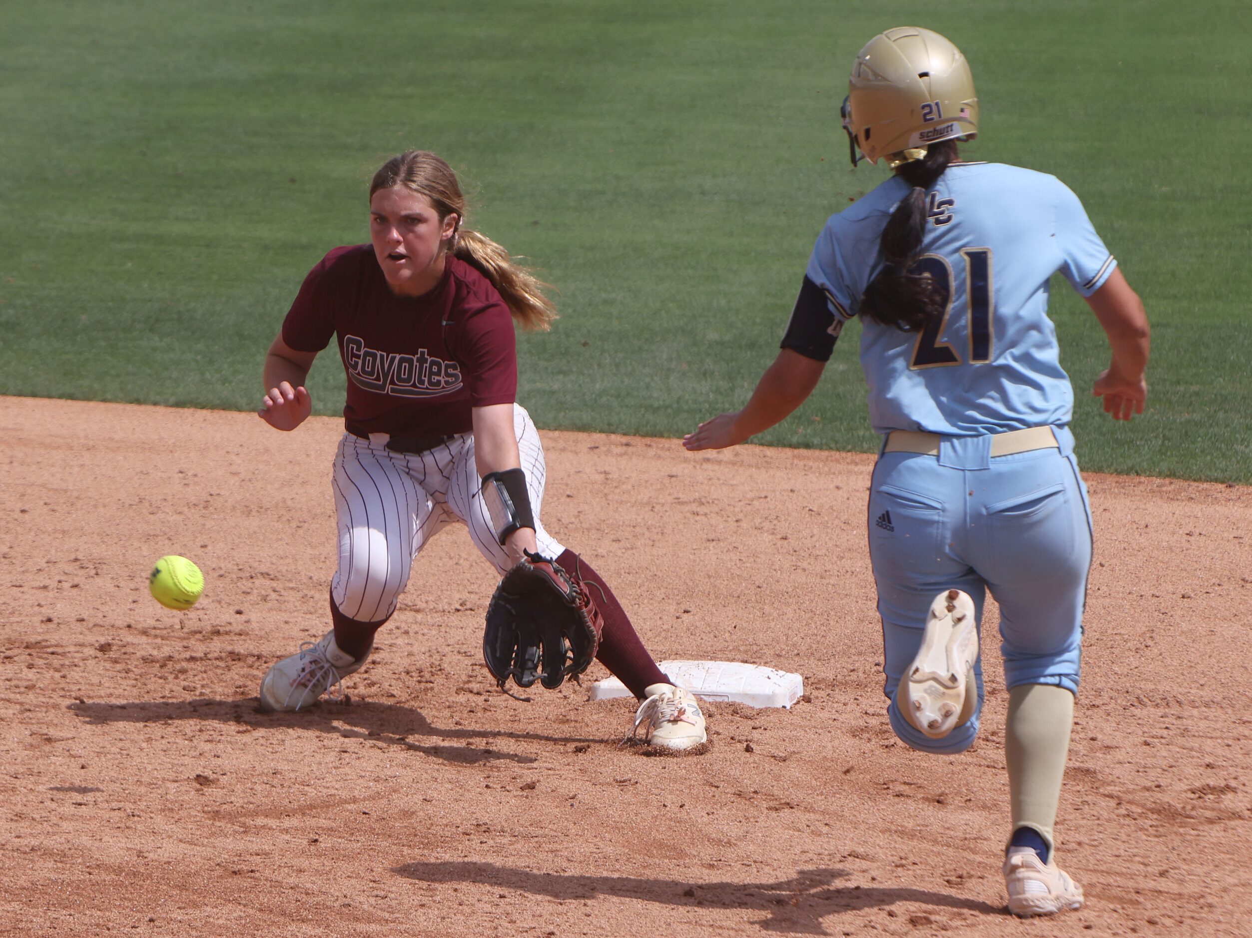 Frisco Heritage shortstop Ahna Van meter (5) takes the thrown 2nd base in an attempt to stop...