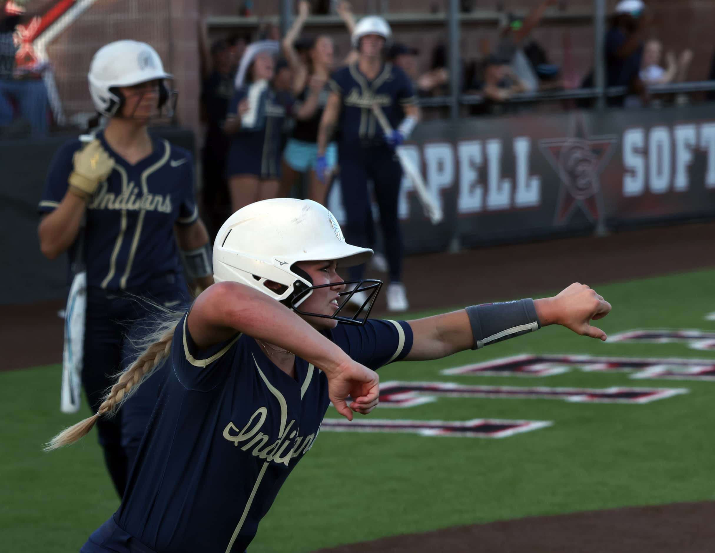 Keller's Mackenna Jackson (8) reacts after scoring her team's first run in the top of the...