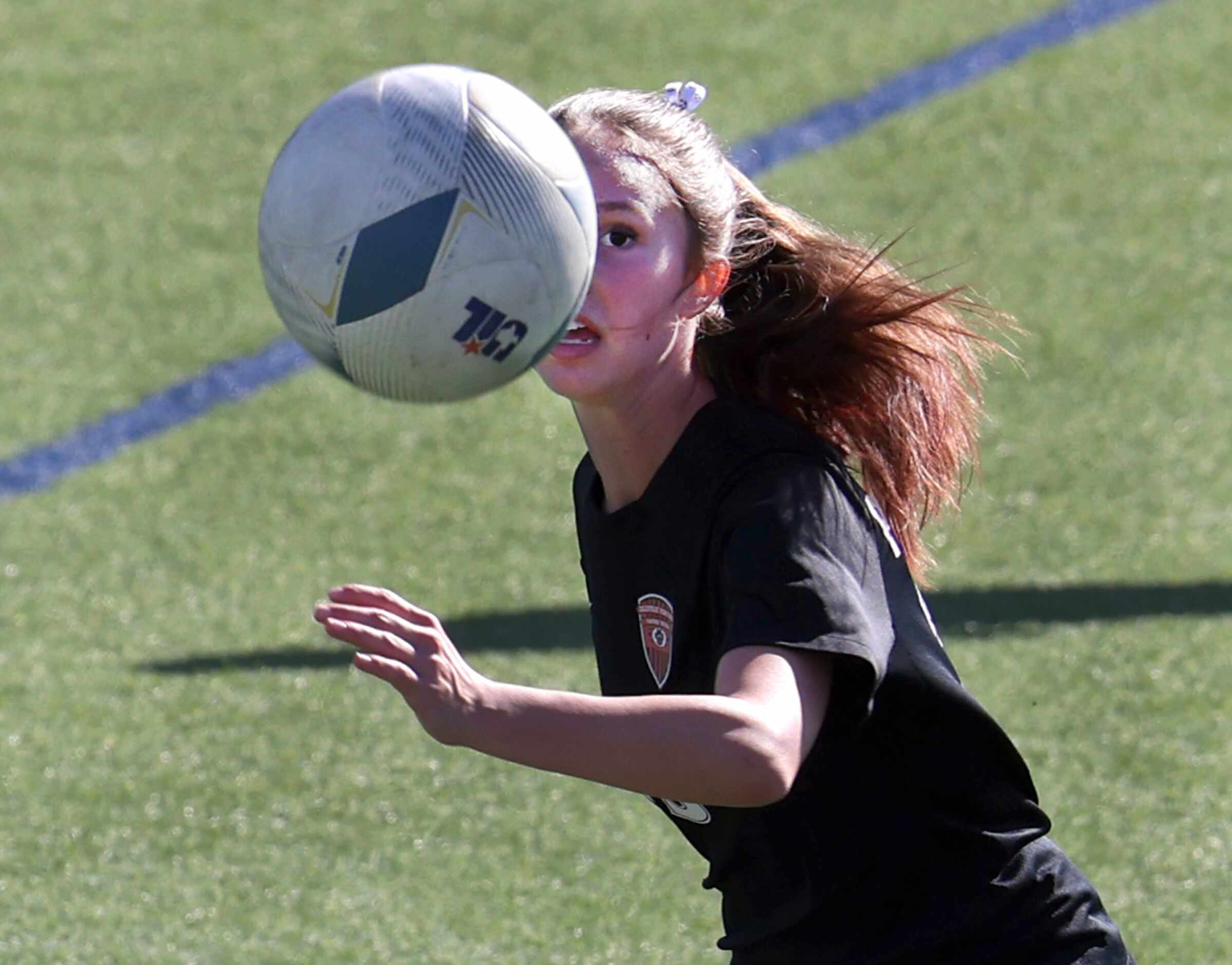  Colleyville Heritage forward Ashlyn Bringedahl (13) eyes the ball during first half action...