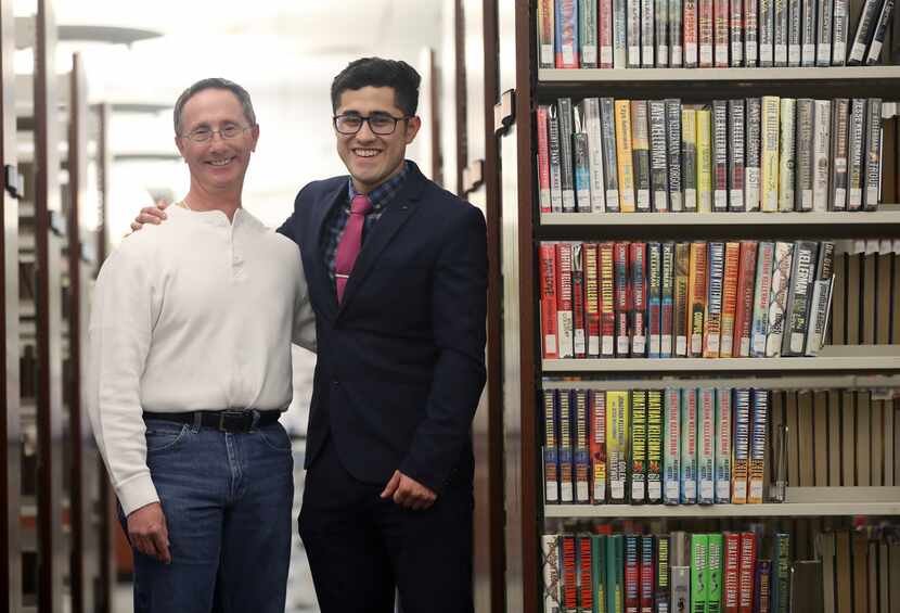Alfred Hersh (left) and Luis Ruiz at the public library in Carrollton,  where they...