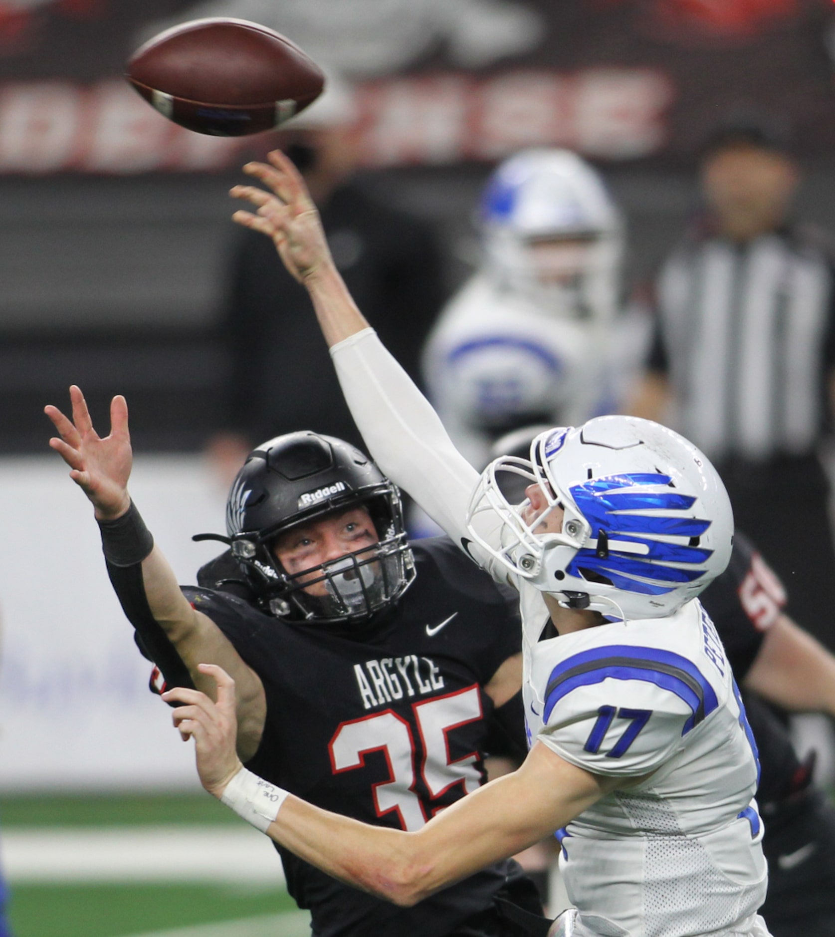 Lindale quarterback Sam Peterson (17) is forced to rush a pass downfield due to the...