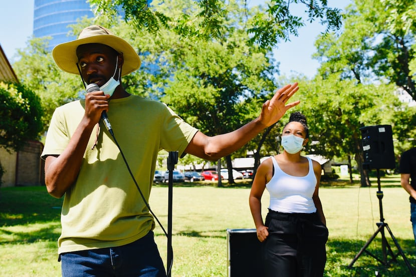 Jeziel Jones (left), head organizer for the Potluck Protest, tells volunteers to run to...
