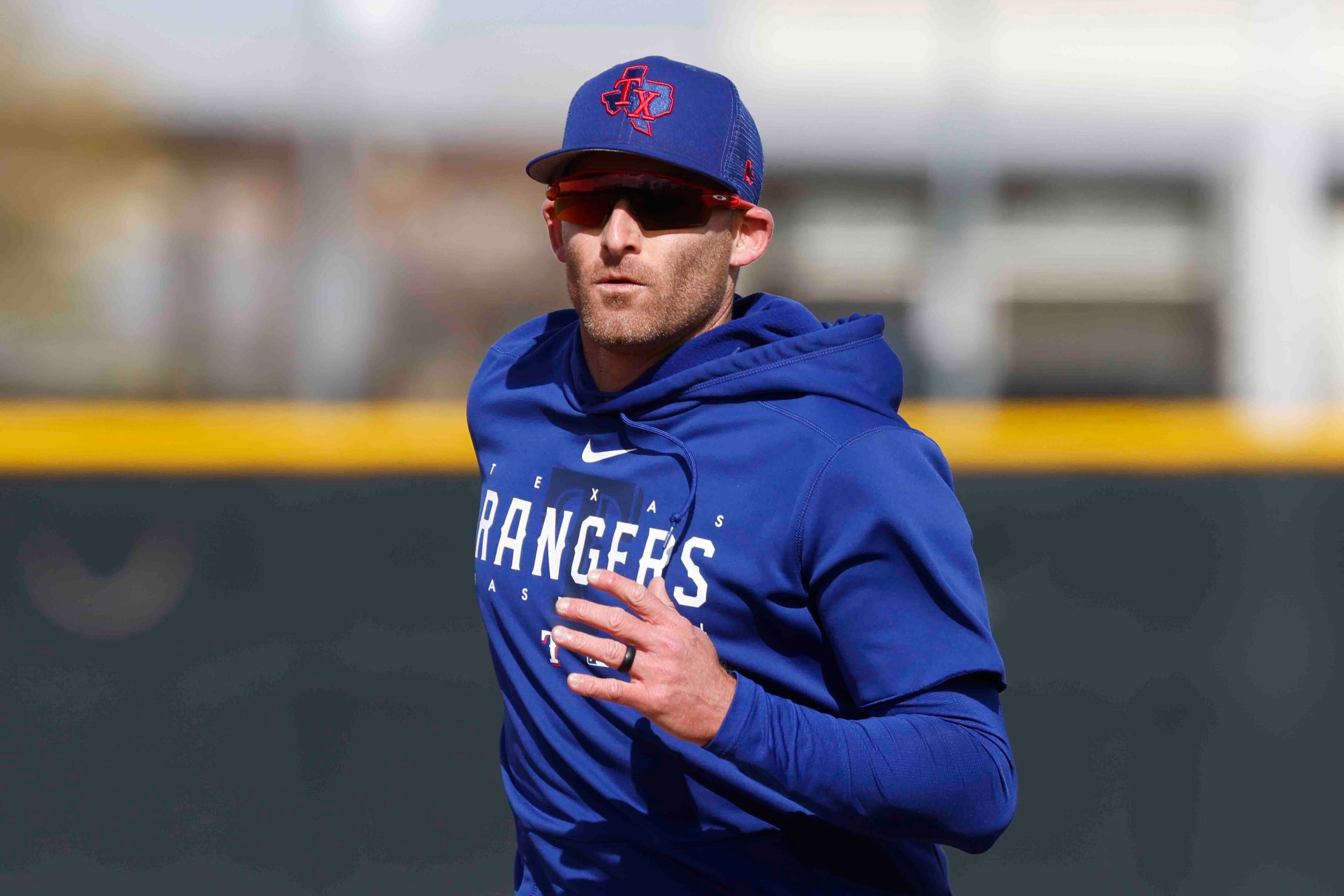 Texas Rangers outfielder Brad Miller runs between bases during a spring training workout at...