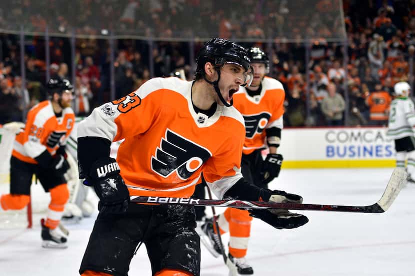 Philadelphia Flyers' Shayne Gostisbehere screams after scoring a goal during the second...