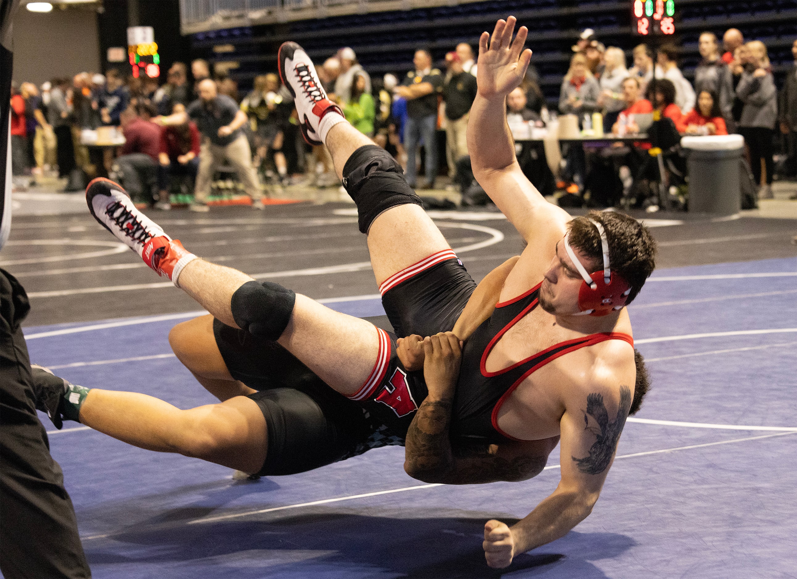 Drake Madole from Allen (right) wrestles Jarra Anderson from Katy Paetow in the 6A boys 285...