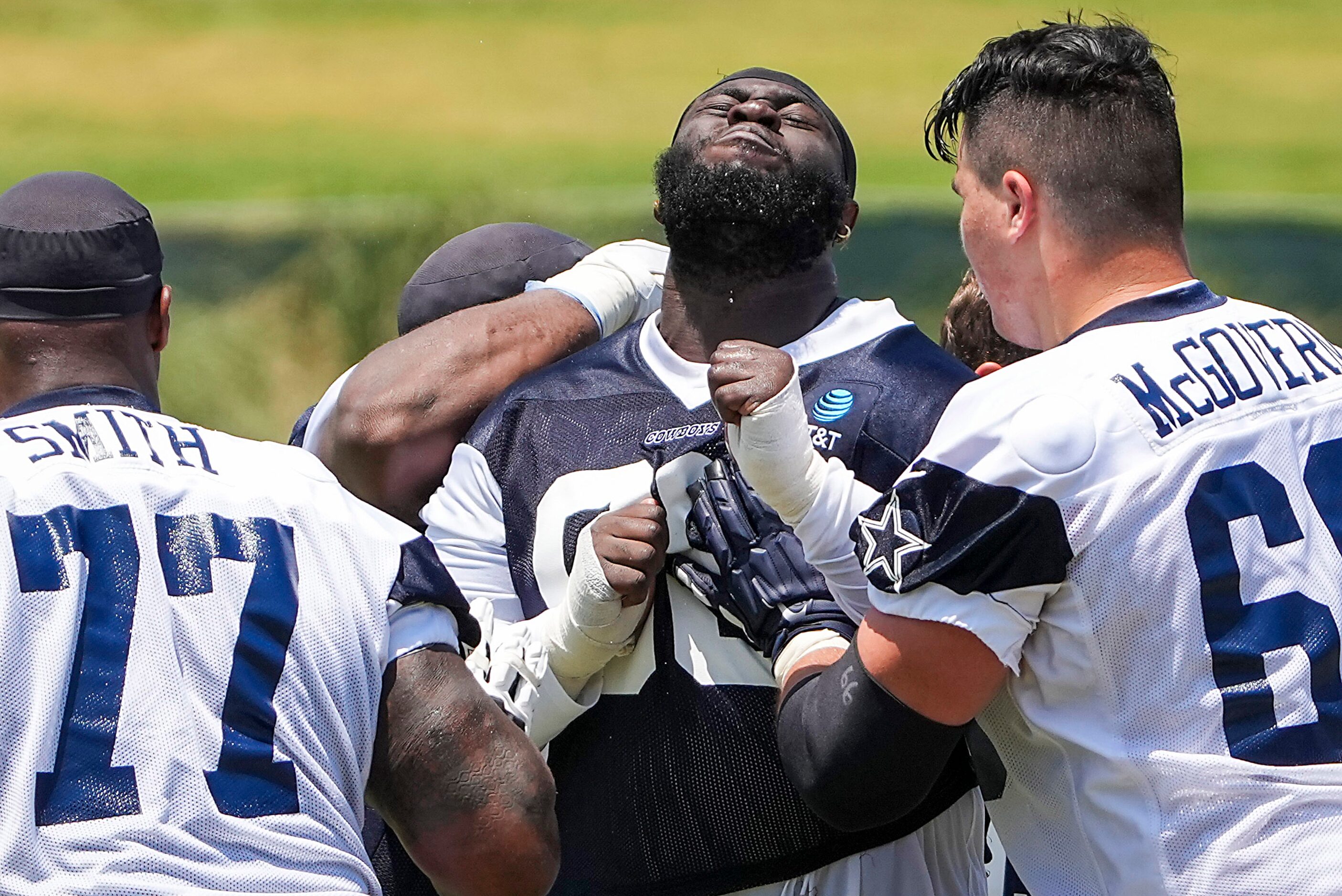 Dallas Cowboys defensive tackle Neville Gallimore (96) works against tackle Tyron Smith (77)...