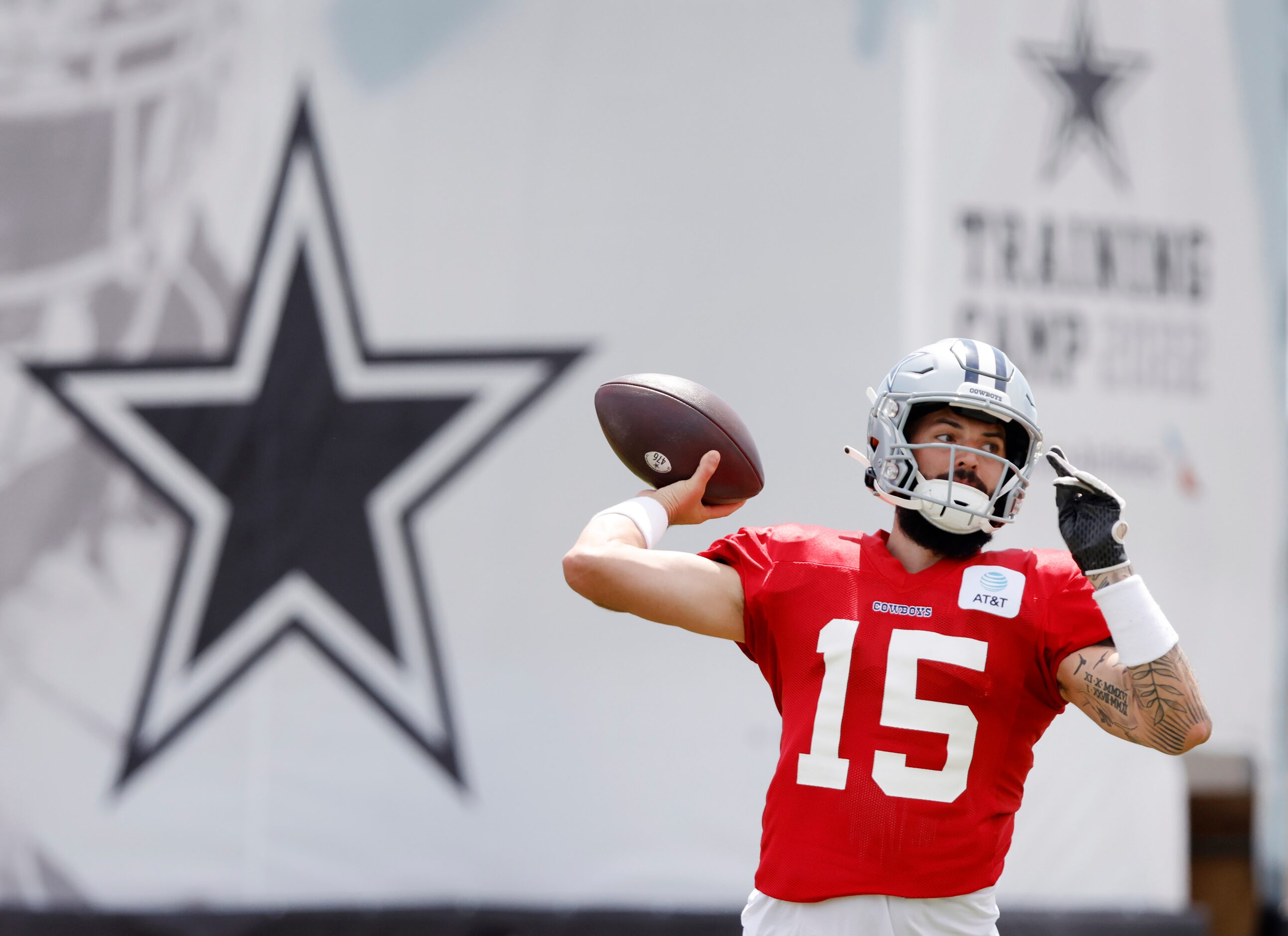 Dallas Cowboys quarterback Will Grier (15) throws  during training camp practice passing...