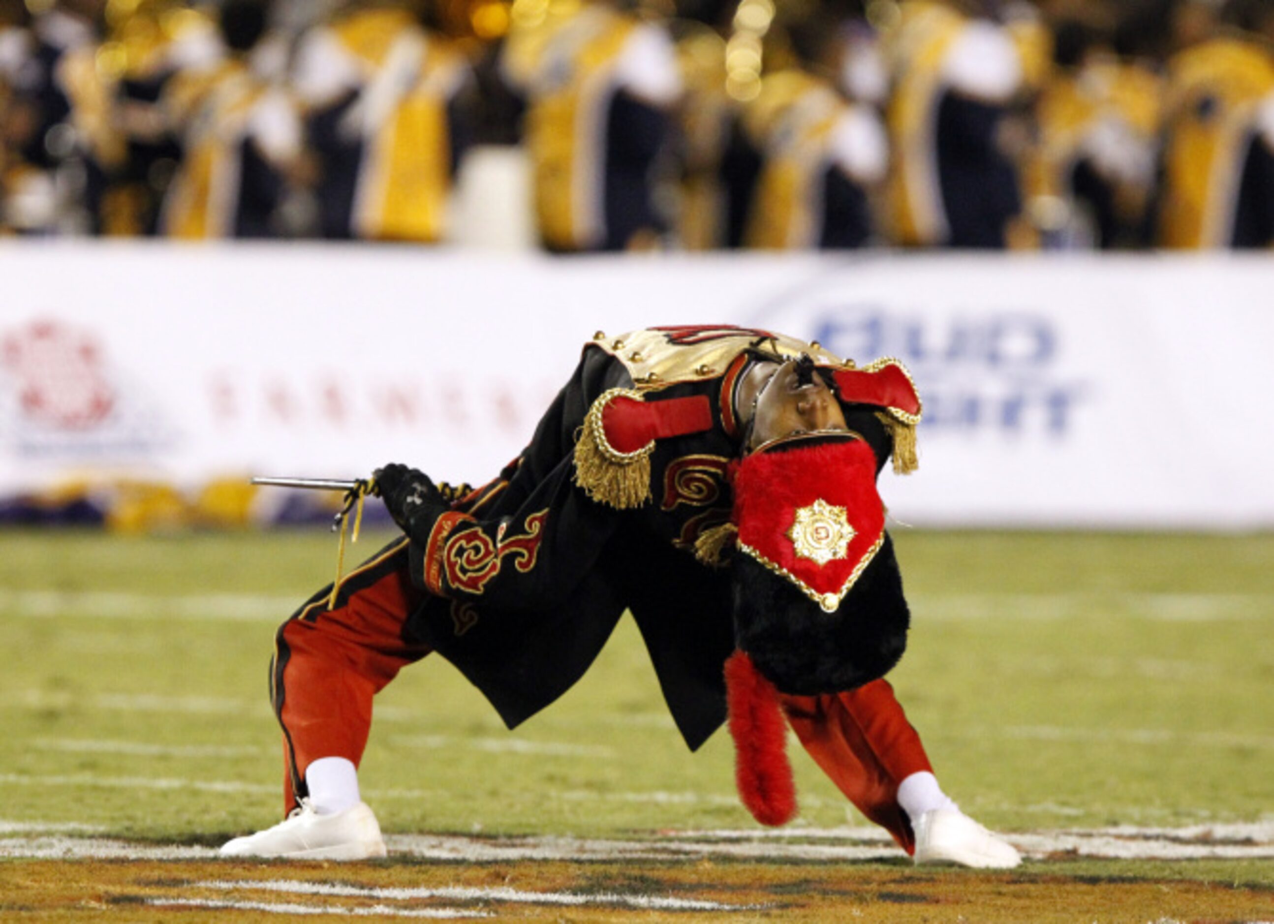 A Grambling drum major bends over backward to please fans during the halftime show of a NCAA...