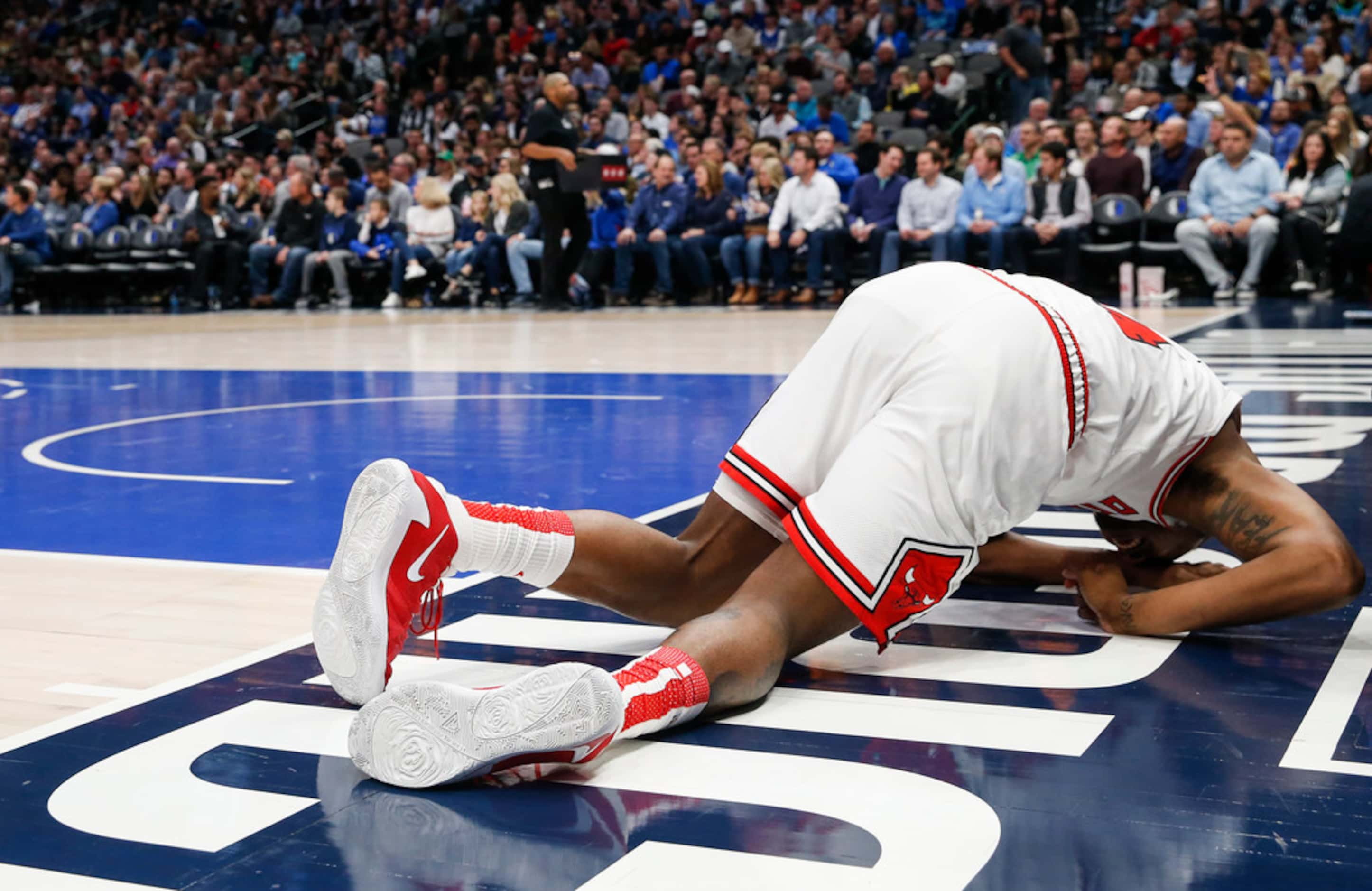 Chicago Bulls center Wendell Carter Jr. (34) falls to the floor injured during the second...