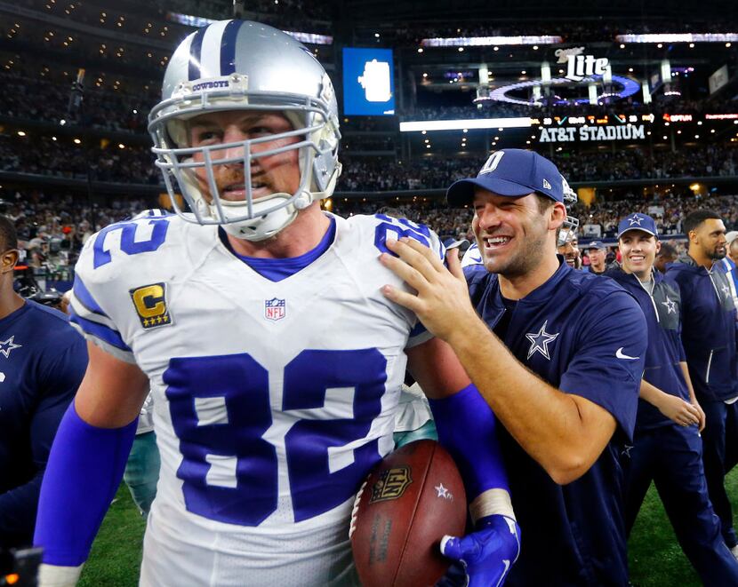 Dallas Cowboys tight end Jason Witten (82) is congratulated by quarterback Tony Romo (right)...