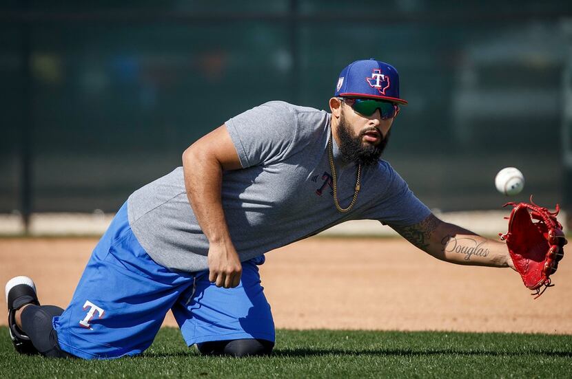 Texas Rangers infielder Rougned Odor takes infield practice during a spring training workout...