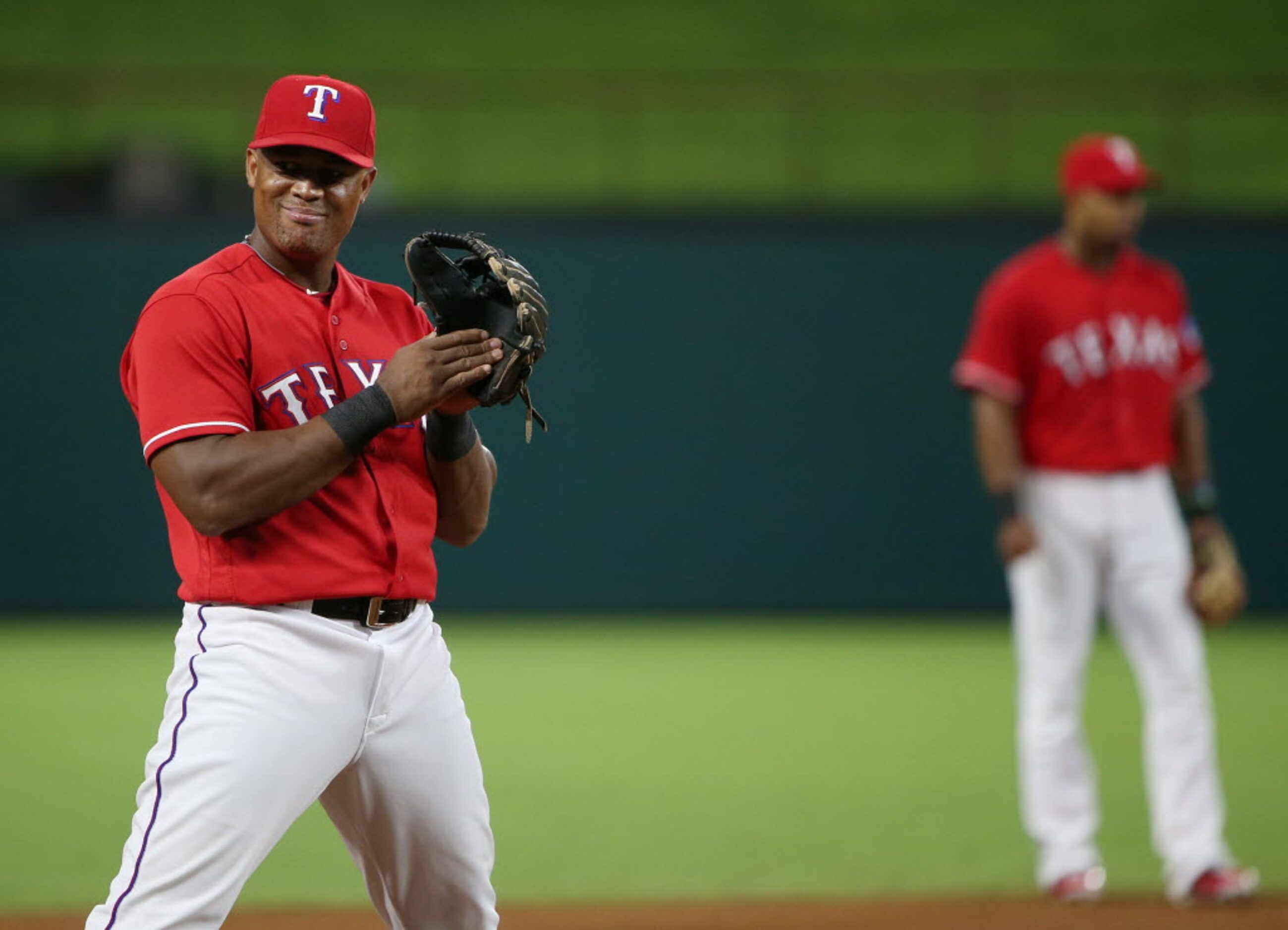 Texas Rangers third baseman Adrian Beltre (29) looks toward to the Oakland Athletics dugout...