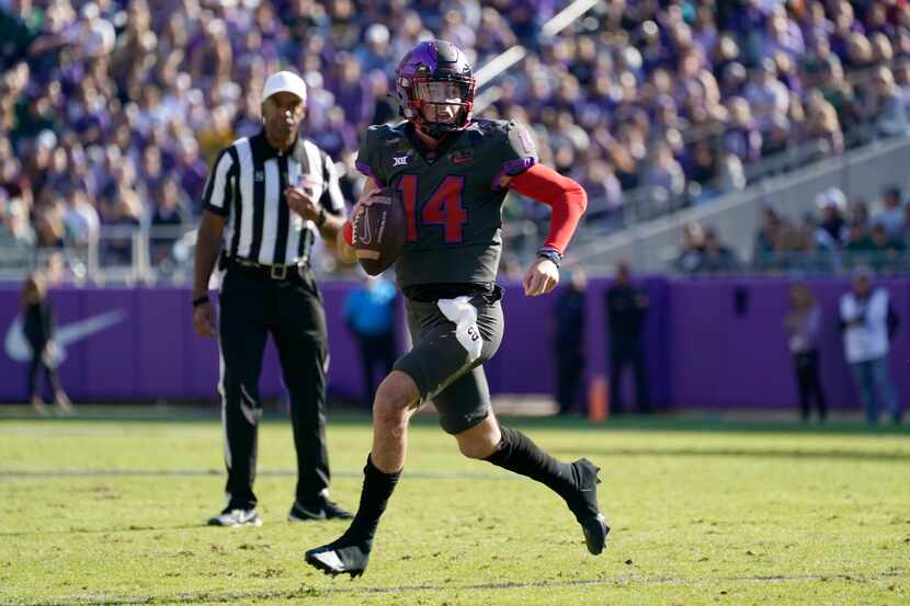 FILE - TCU quarterback Chandler Morris scrambles out of the pocket during an NCAA college...