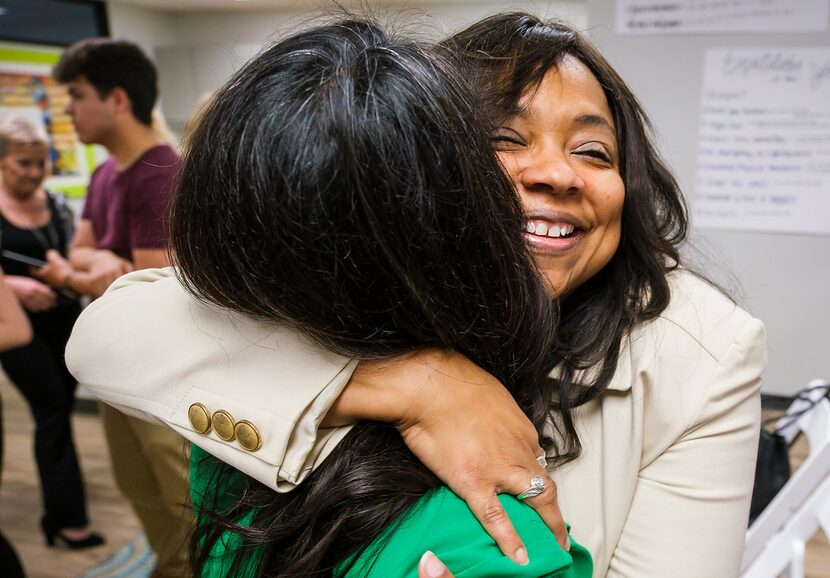 Lavinia Masters hugs Rep. Victoria Neave after Governor Greg Abbott signed House Bill 8...