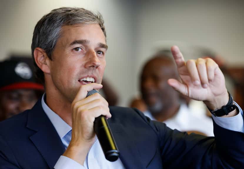 Texas Governor candidate Beto O'Rourke talks to patrons at Kutinfed Barbershop in Dallas on...