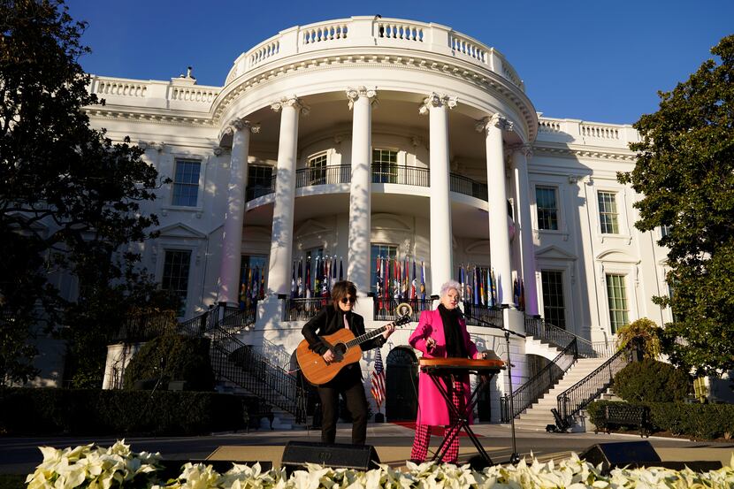 Singer Cyndi Lauper performs before President Joe Biden arrives to speak during a bill...
