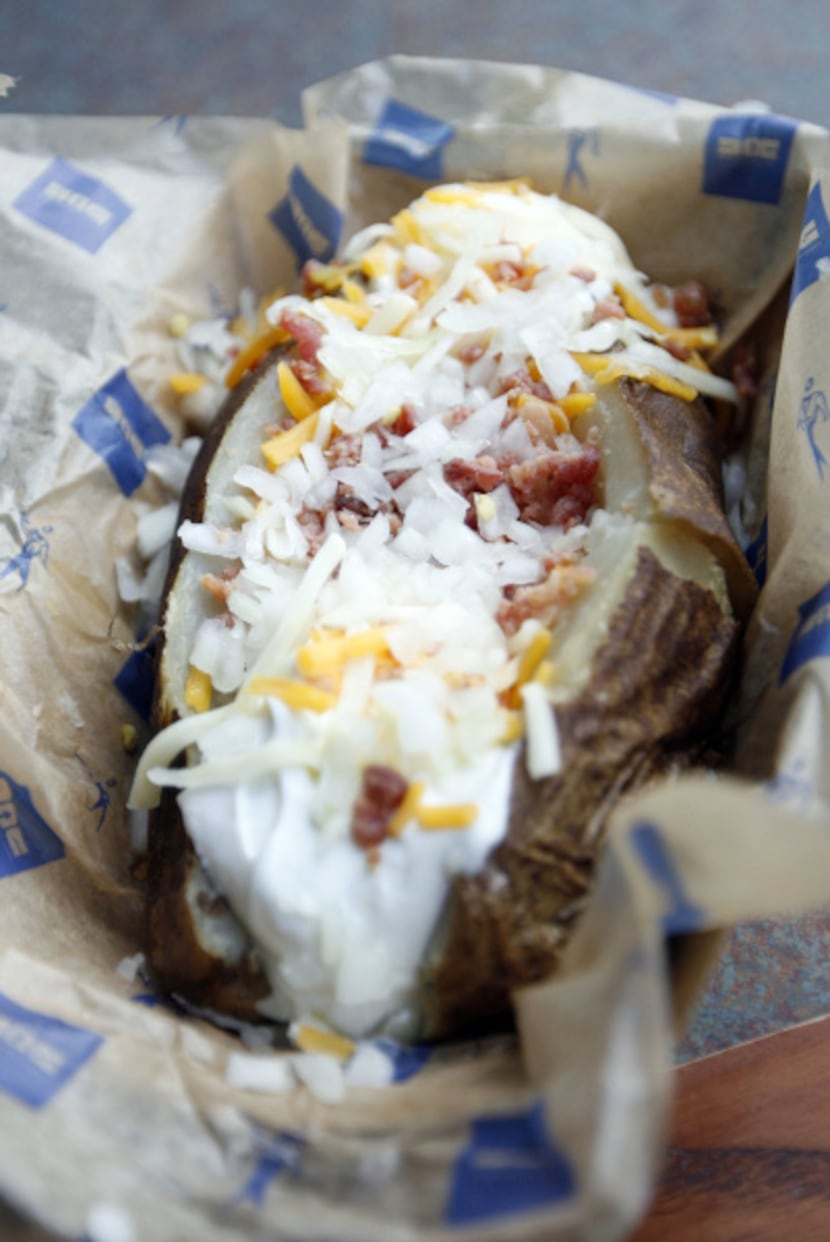 NOT THAT: A loaded baked potato at the ballpark has 450 calories and 26 grams of fat. To...