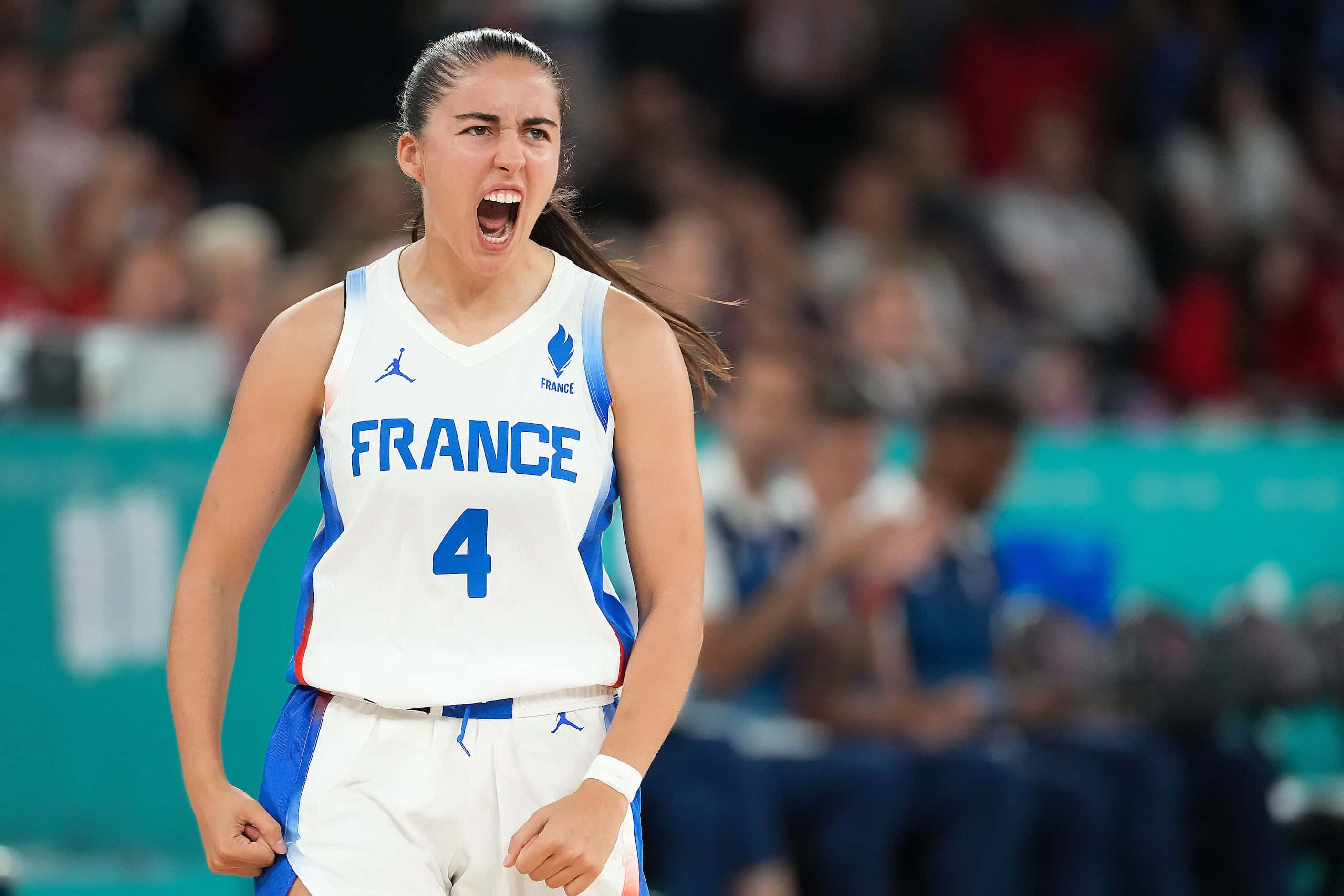 Marine Fauthoux (4) of France celebrates hitting a 3-pointer during the first half of the...