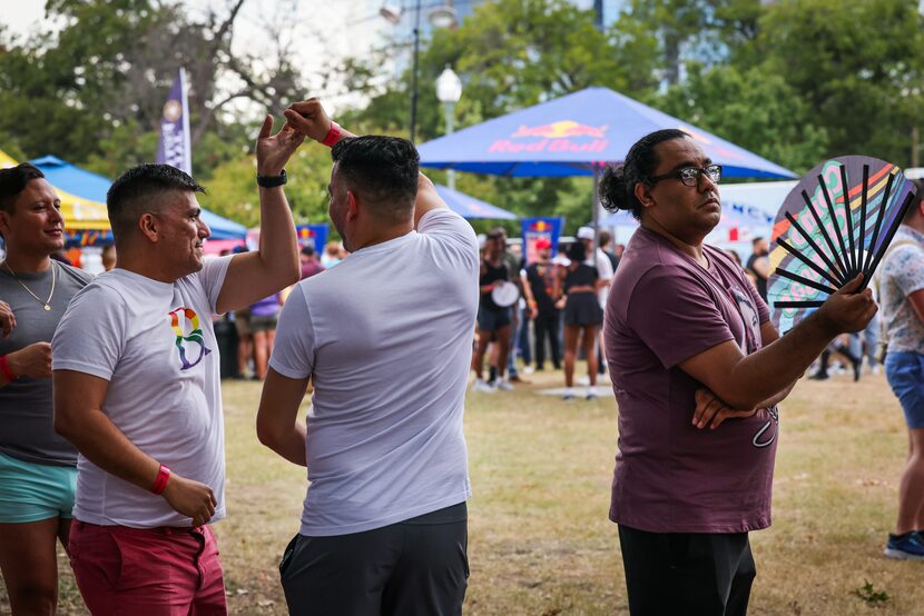 Festivalgoers dance while waiting in line for drinks during the festival. 