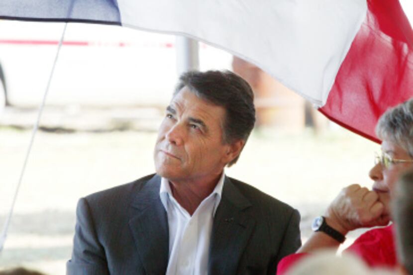 Texas Gov. Rick Perry attended a political rally and barbecue at the Kaufmann family farm...