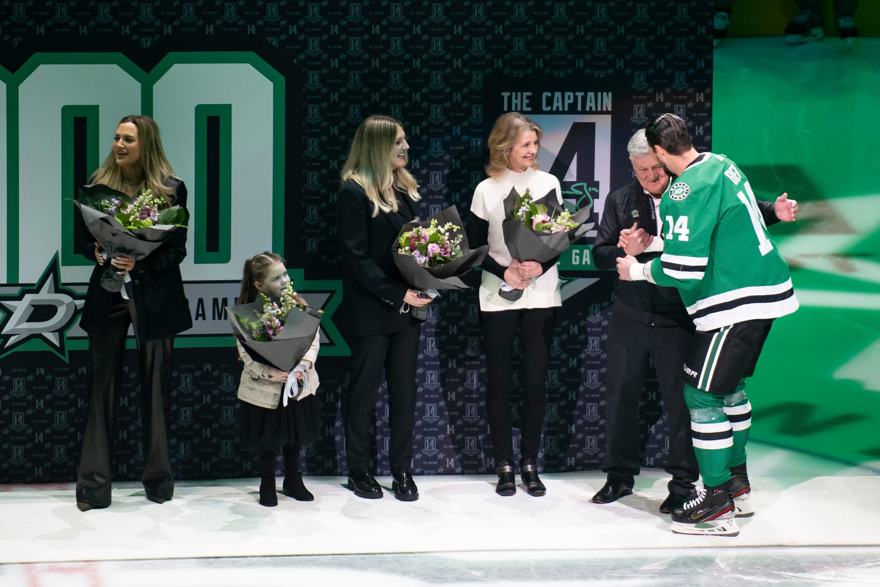 Dallas Stars left wing Jamie Benn (14) hugs his father, Randy, during a ceremony prior to an...