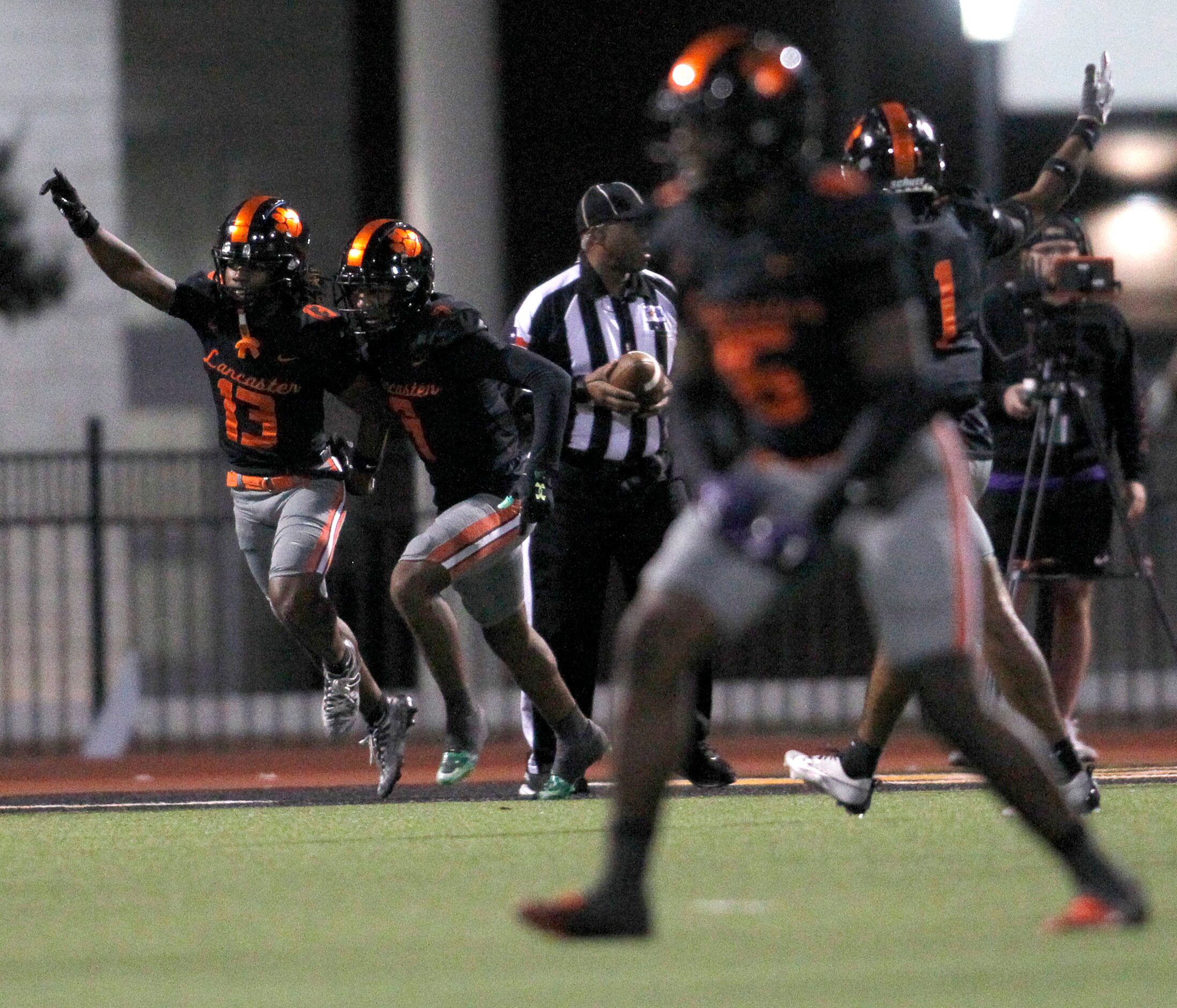 Lancaster defensive backs Jerbrandin Henderson (13), left, and Kameron Robinson (1)...