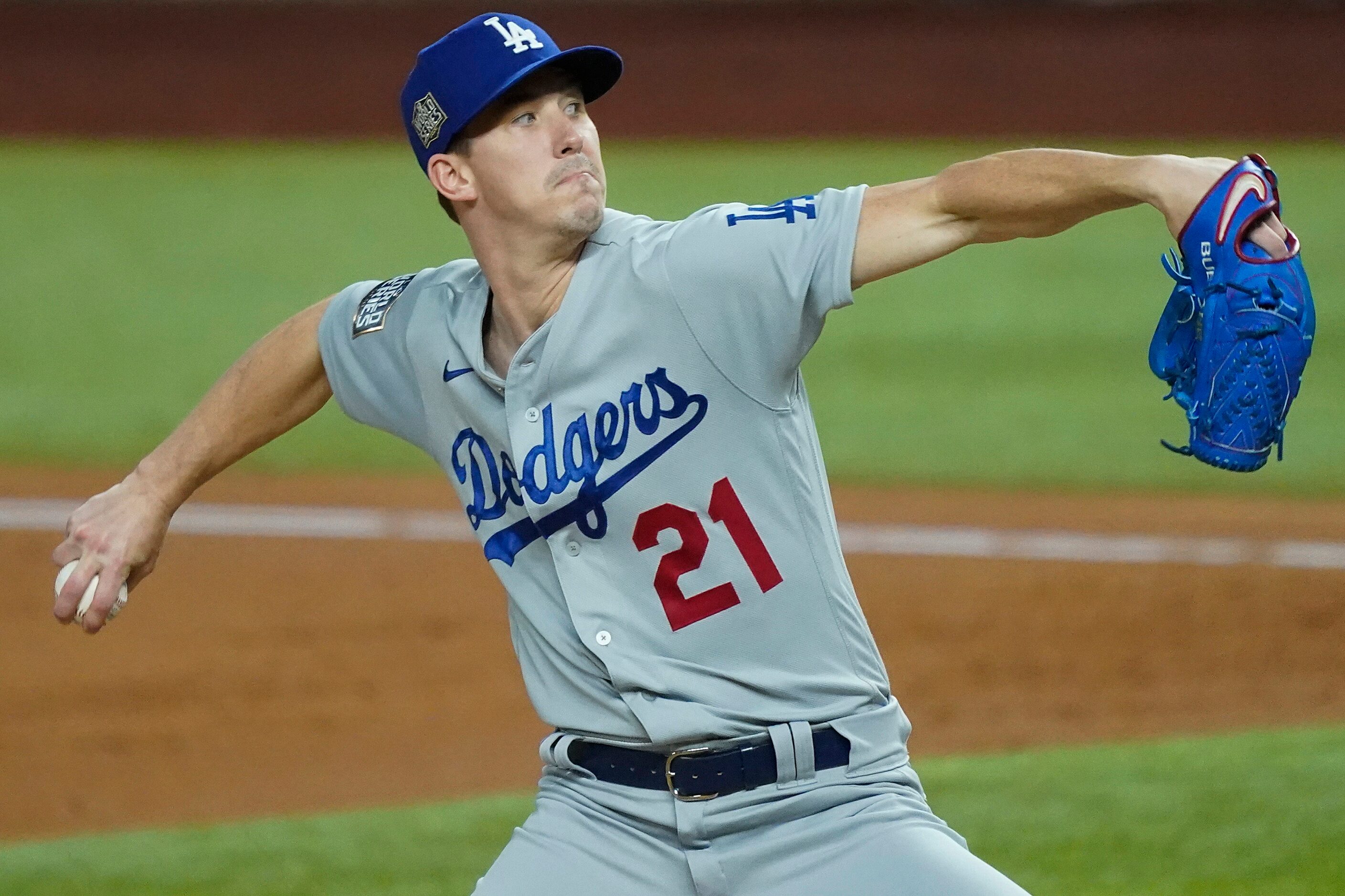 Los Angeles Dodgers starting pitcher Walker Buehler delivers during the first inning against...