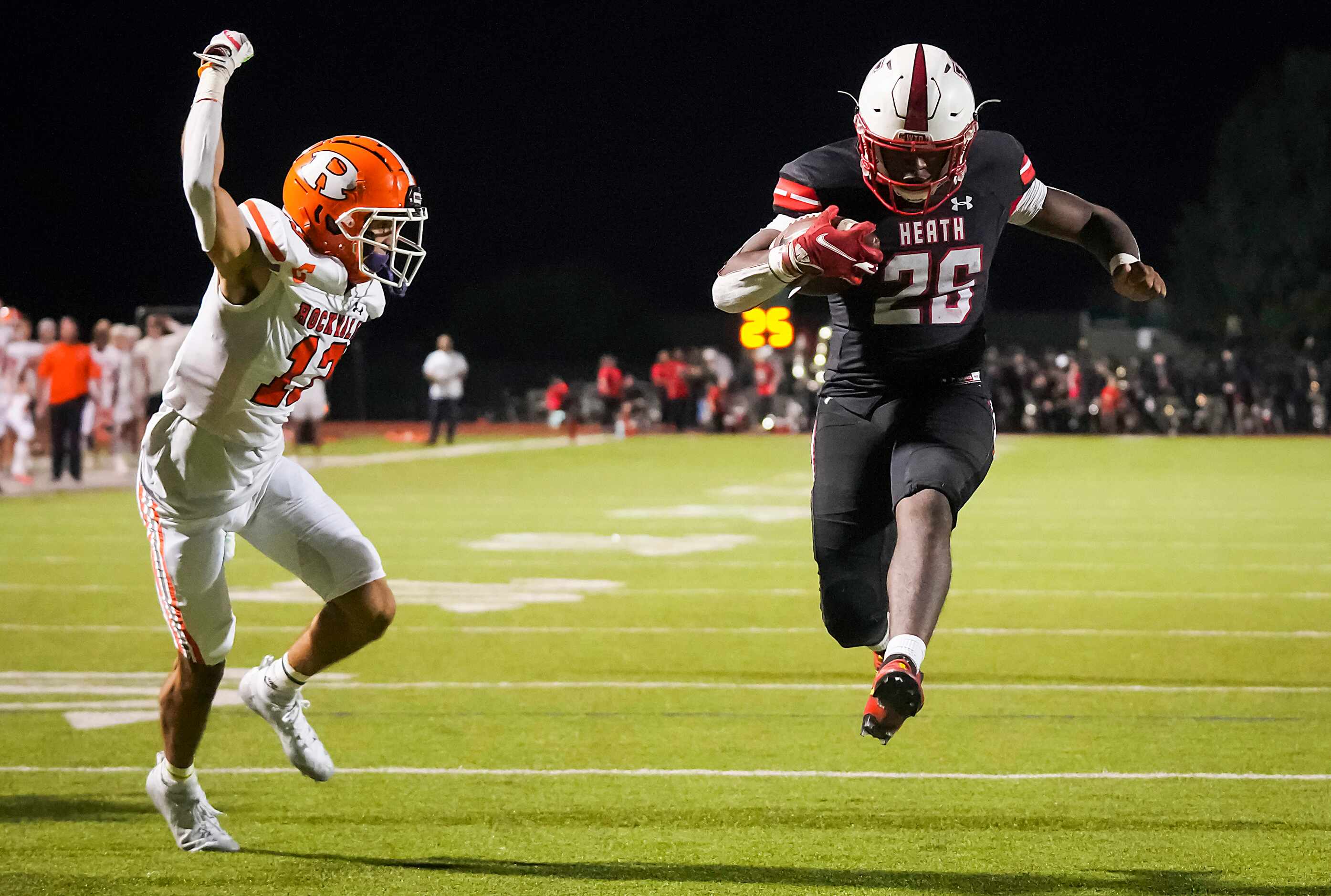 Rockwall-Heath running back  Zach Evans (26) scores on a 3-yard touchdown run past Rockwall...