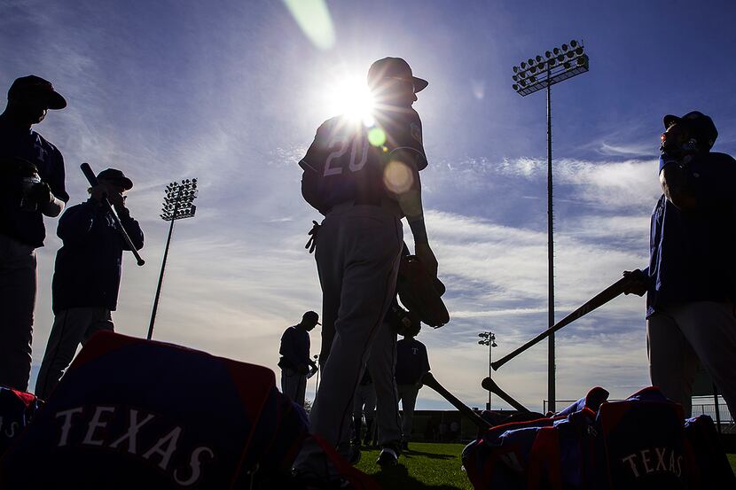 Texas Rangers outfielder Ian Desmond (20) talks with first baseman/designated hitter Prince...