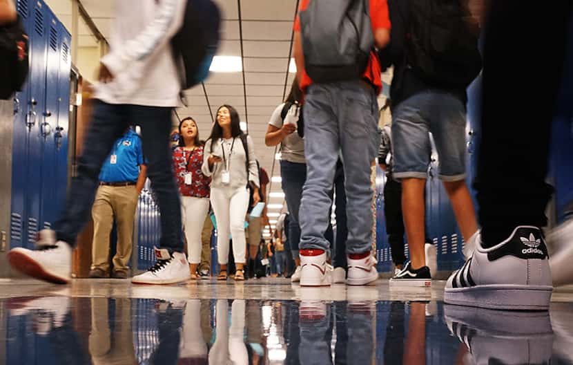 Students crowd the halls on the first day of school Monday at Grand Prairie High School.