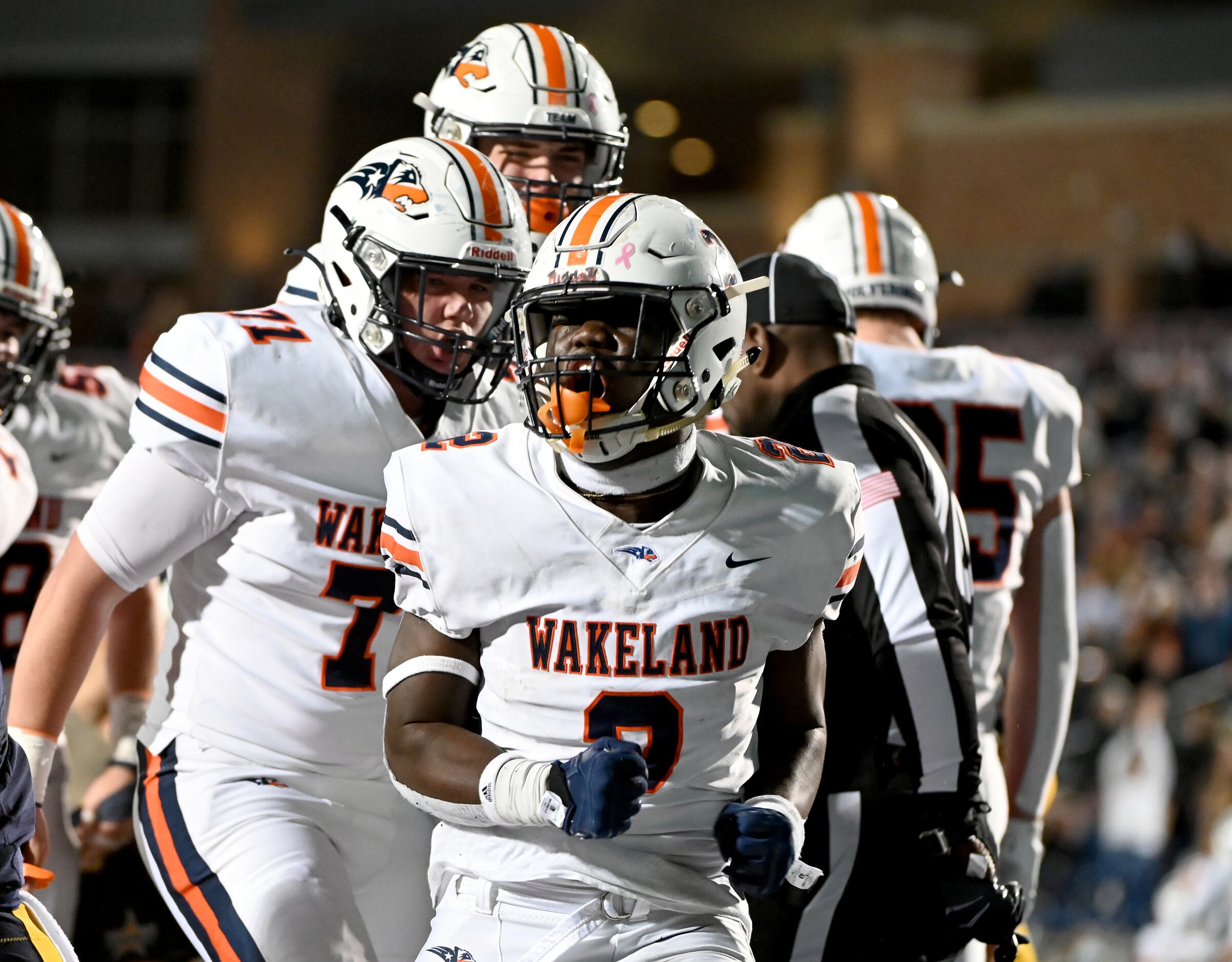 Wakeland's Jared White (2) celebrates after his touchdown run in the first half of a Class...