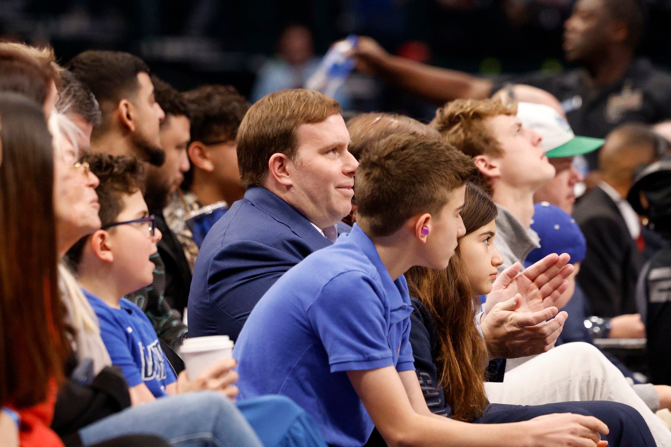 Dallas Mavericks Governor Patrick Dumont, center, is seen during the first half of an NBA...