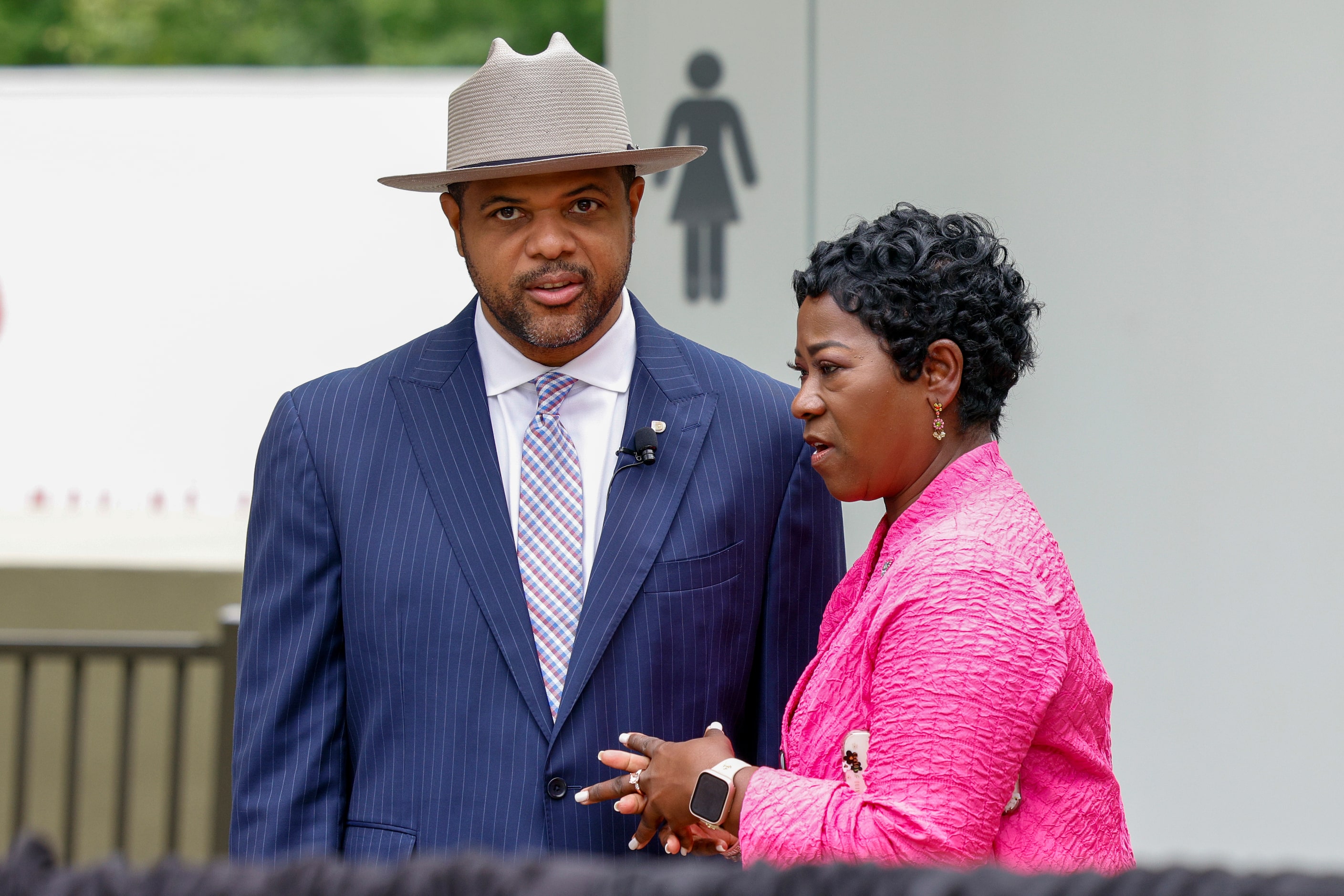 Dallas Mayor Eric Johnson speaks with interim city manager Kimberly Bizor Tolbert at Klyde...