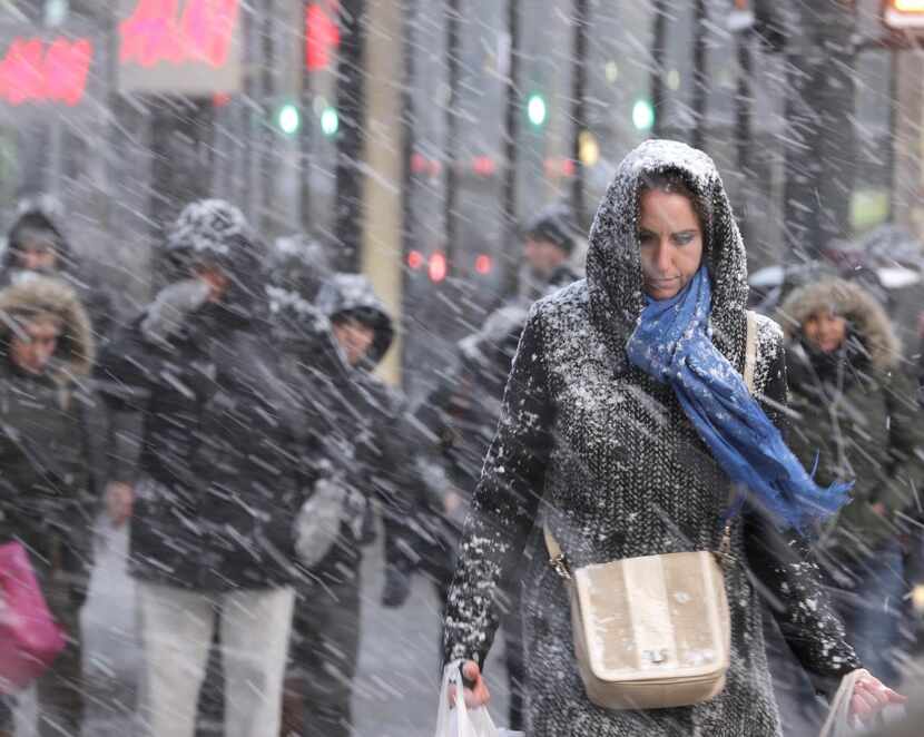 New Yorkers forged  through driving snow in midtown Manhattan on Monday, and conditions were...