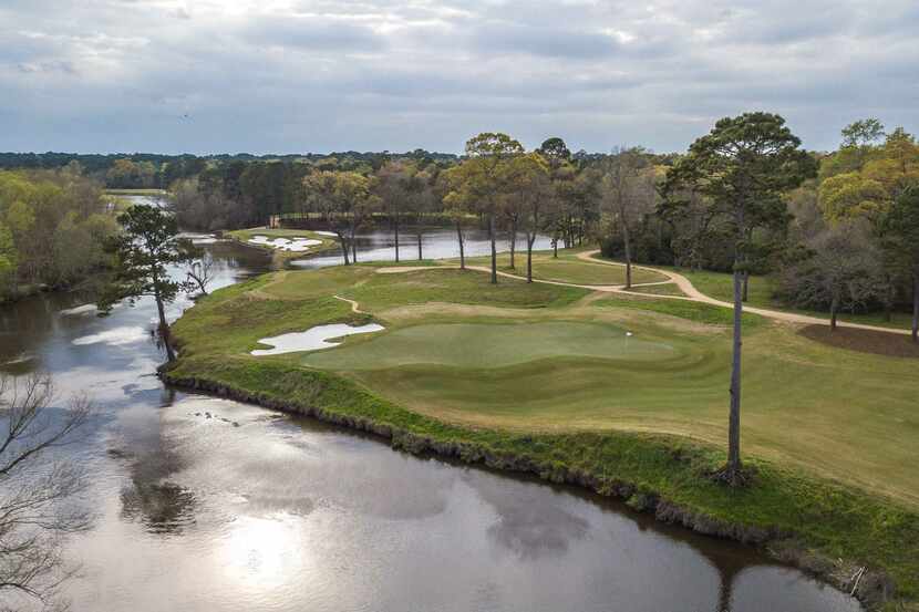 An aerial view of the par-4 14th green (foreground) and par-3 15th at Whispering Pines Golf...