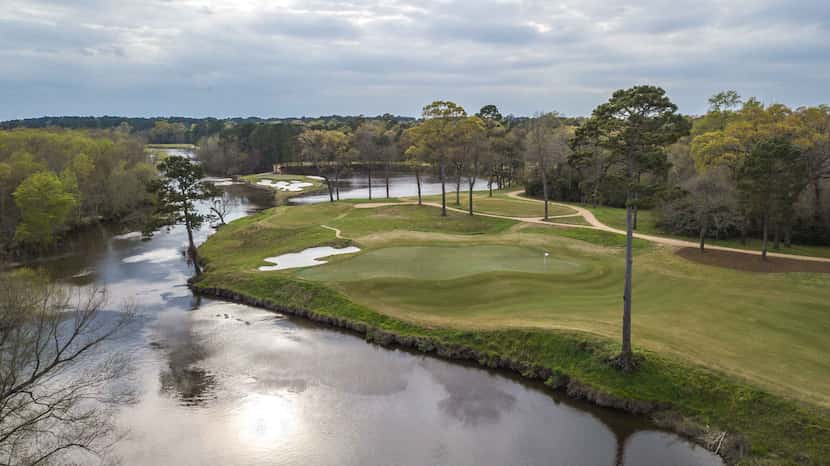 An aerial view of the par-4 14th green (foreground) and par-3 15th at Whispering Pines Golf...