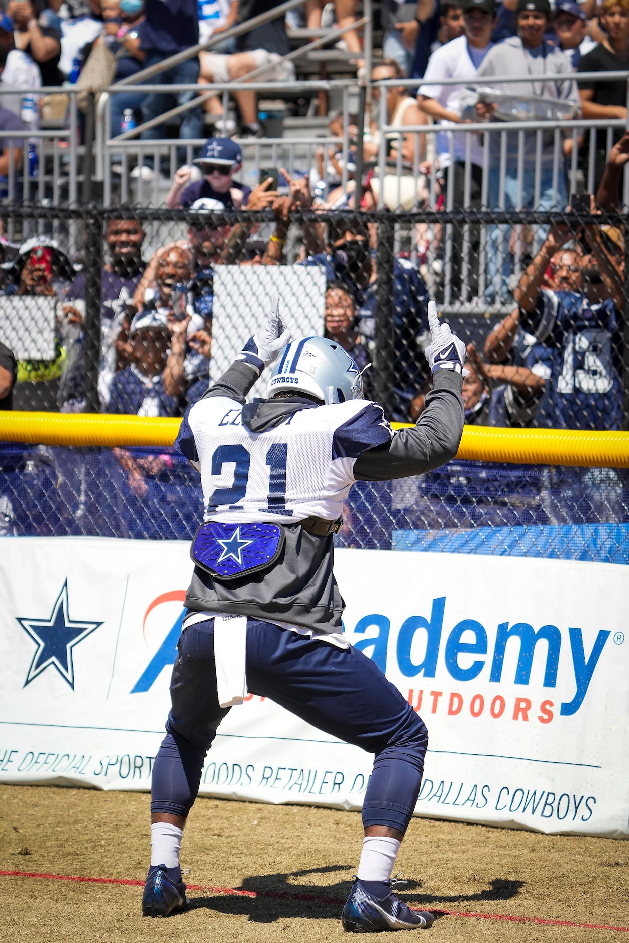 Dallas Cowboys running back Ezekiel Elliott interacts with fans during a practice at...